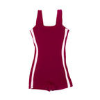 Front flat lay view of The OG boy leg one-piece swimsuit in cherry maroon with pink side stripe detail and round scoop neckline.