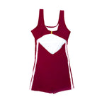 Back flat lay view of The OG boy leg one-piece swimsuit showing pink side stripe detail, full coverage fit, gold clasp back closure, and open scoop back design.